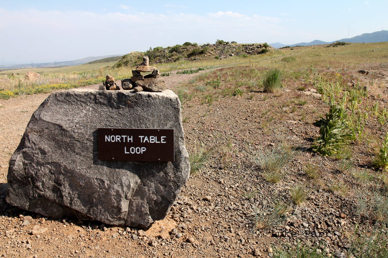 A flat top with sides that rise steeply from plains below. Rocky Mountain Adventure North Table Mountain Park